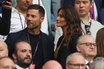 Xabi Alonso wife Nagore Aranburu elegant couple at football stadium event